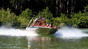 Safari boat ride skimming over the water 